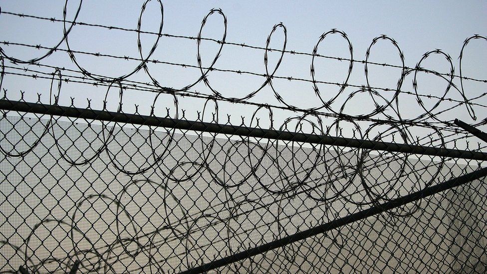 Barbed perimeter wire at Santa Barbara prison, California