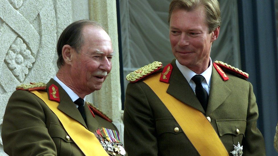 Grand Duke Henri of Luxembourg smiles at his father Jean as they appear on the balcony in Luxembourg on 7 October 2000