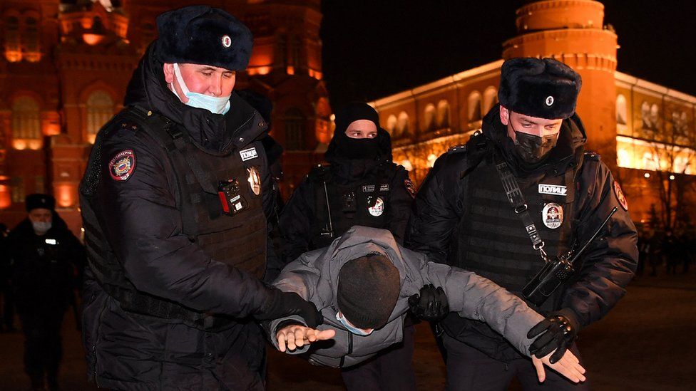 Police officers detain a man during a protest against Russia's invasion of Ukraine in central Moscow on 2 March 2022