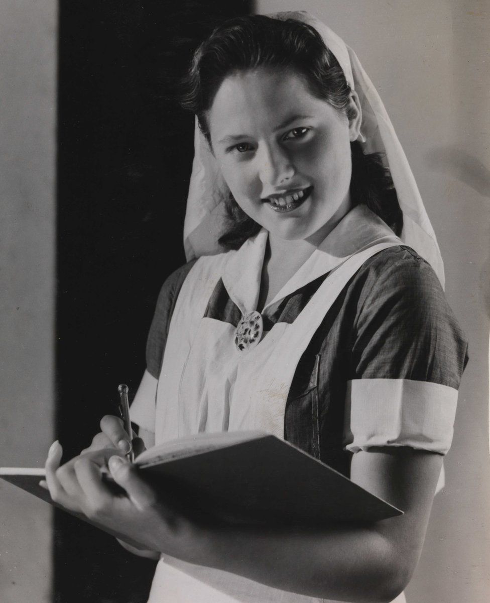A nurse in old-fashioned uniform