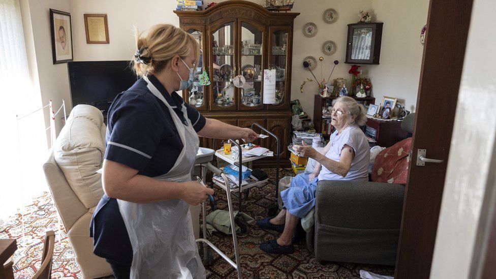 Carer in woman's home