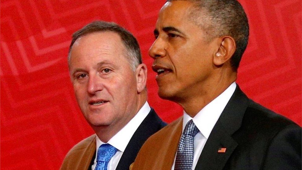 New Zealand Prime Minister John Key and U.S. President Barack Obama arrive wearing Peruvian shawls, for a family photo at the APEC Summit in Lima, Peru, November 20, 2016.