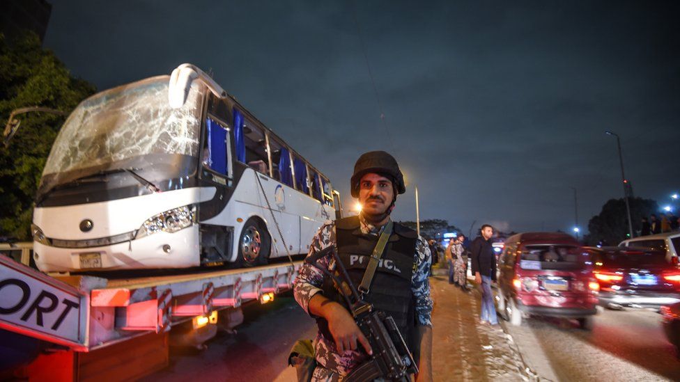 Image shows a tourist bus which was attacked being towed away from the scene, in Giza province south of the Egyptian capital Cairo.
