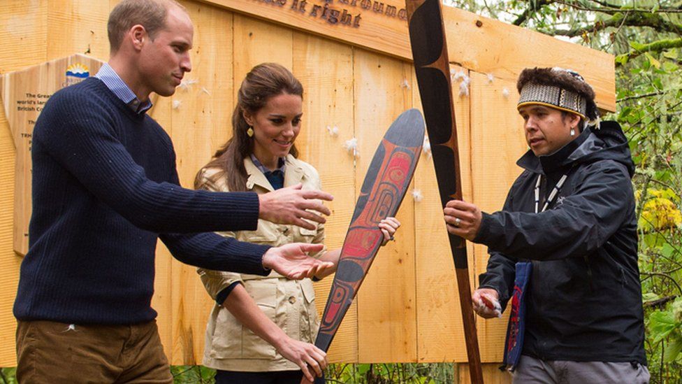 The Duke and Duchess of Cambridge are presented with canoe paddles as a gift from the Heiltsuk First Nation community during a visit to the Great Bear Rainforest in Bella Bella, Canada, during the third day of the Royal Tour to Canada
