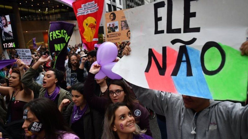 Demonstrators take part in a women protest against Brazilian right-wing presidential candidate Jair Bolsonaro called by a social media campaign under the hashtag #EleNao (Not Him) in Sao Paulo, Brazil, on October 6, 2018.