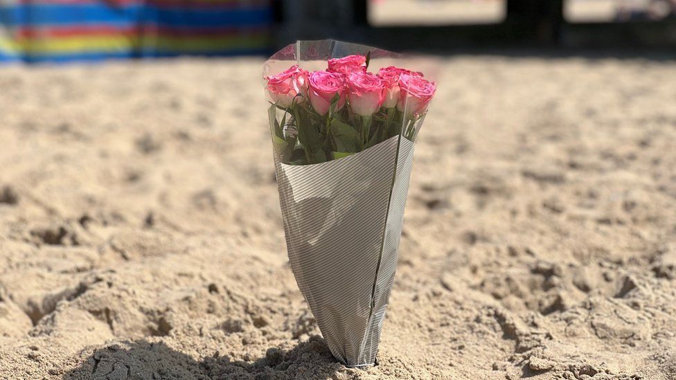 A flora tribute left on the beach