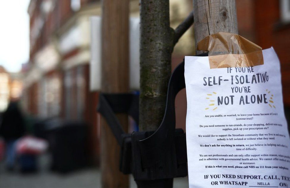 A sign is seen down a London street regarding self isolation as the spread of the coronavirus disease (COVID-19) continues. London,