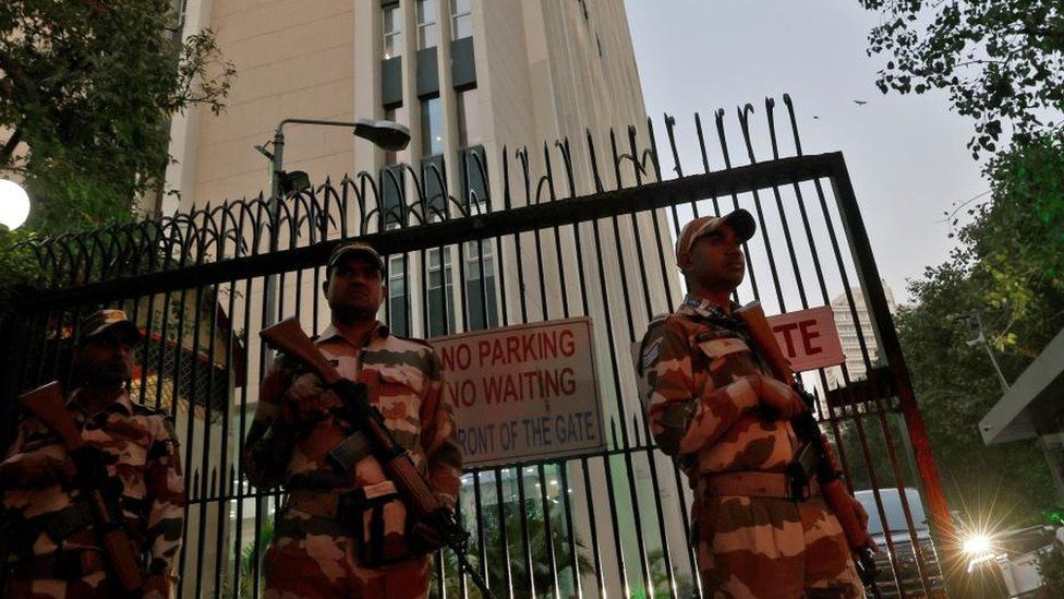 Armed guards outside a BBC office in Delhi, India