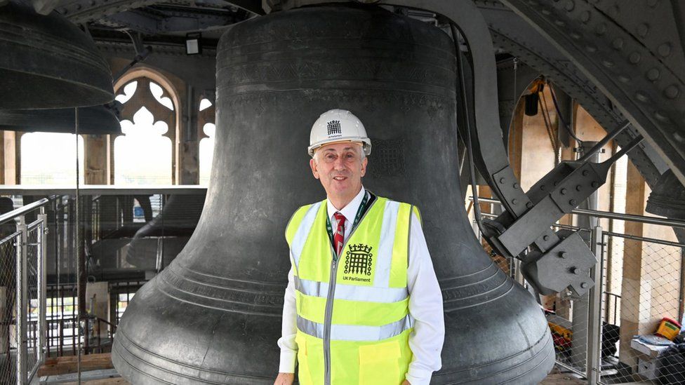 A delighted Commons Speaker Lindsay Hoyle beside the Big Ben bell