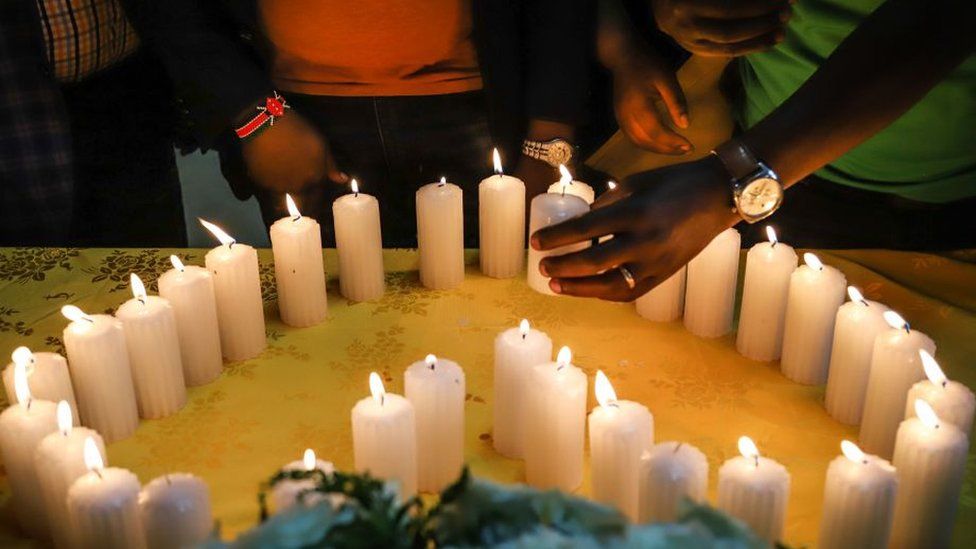 Relatives of Kenyan victims light candles arranged in a heart shape during a memorial service at the Kenyan Embassy in Addis Ababa on 16 March 2019.