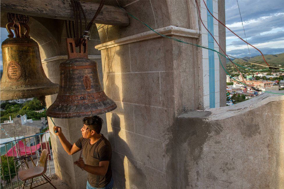 A man rings the church bells in the town of Acatlán, Puebla, Mexico, October 18, 2018