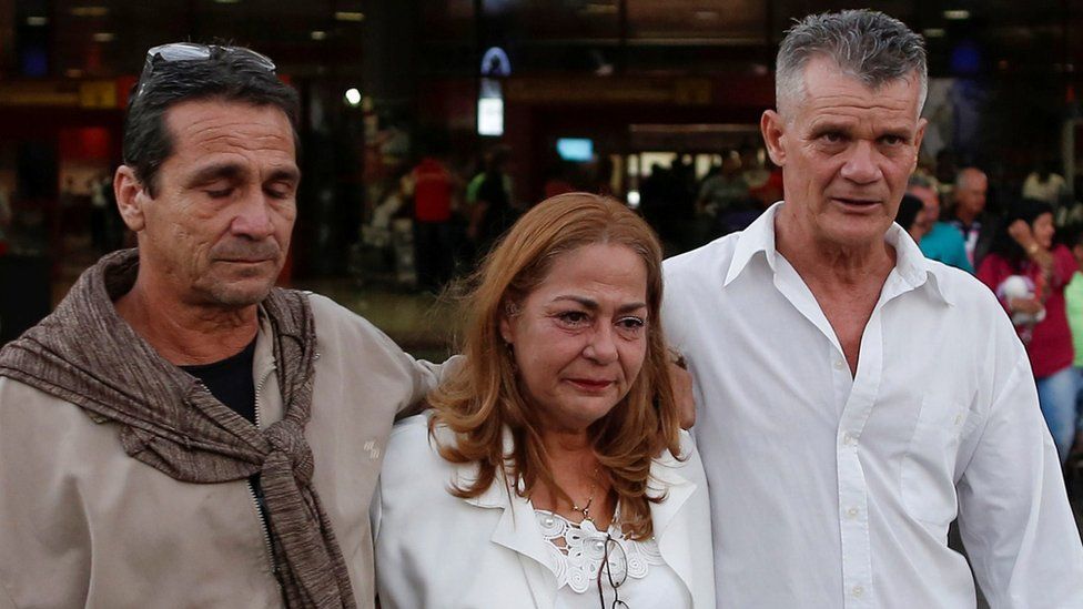 Cuban doctor Rosa Elena Soto, who worked for two years in a small town in Brazil, walks with relatives at the Jose Marti International Airport after arriving from Brazil, in Havana, Cuba, November 23, 2018.