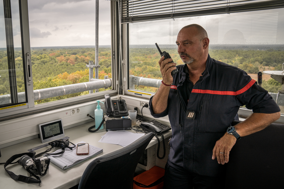 Manuel Escutia in his watchtower in Gironde, where he works seven hour shifts watching for smoke.