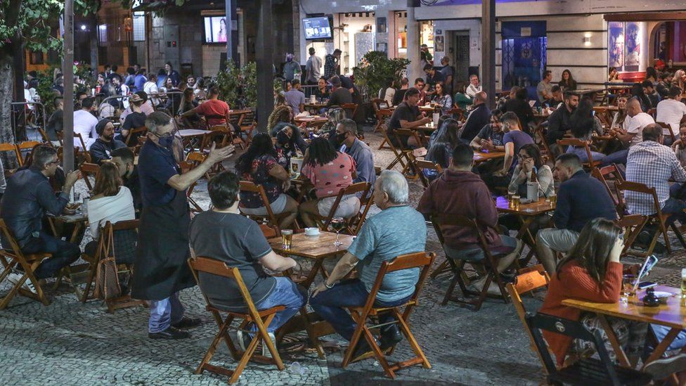 Customers enjoy a bar in Tijuca neighbourhood on the second day after the opening of bars and restaurants