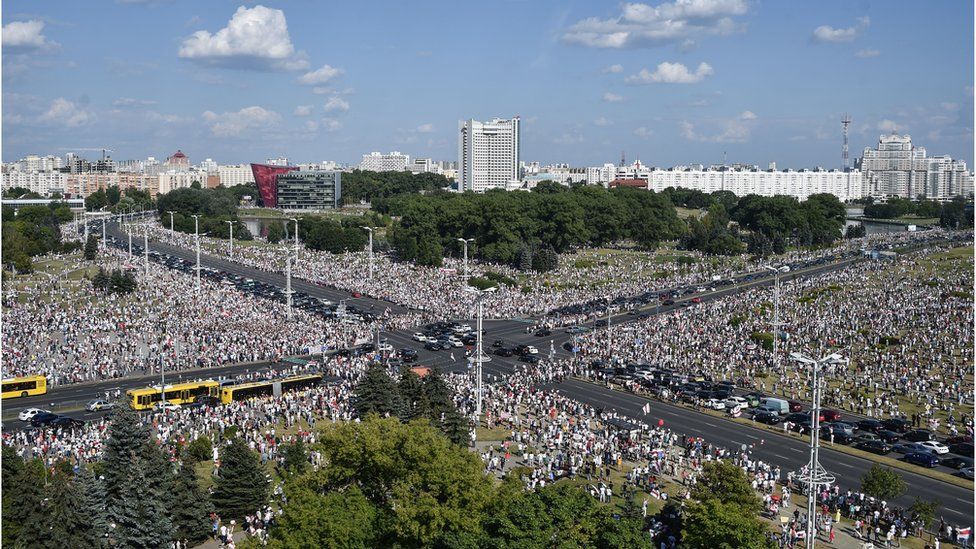Belarus opposition supporters attend a rally in central Minsk on August 16, 2020. - The Belarusian strongman, who has ruled his ex-Soviet country with an iron grip since 1994, is under increasing pressure from the streets and abroad over his claim to have won re-election on August 9, with 80 percent of the vote