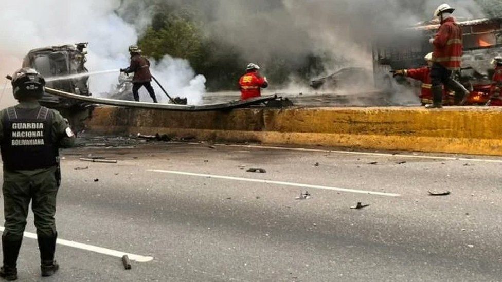 Firefighters and members of the National Bolivarian Guard pictured at the scene