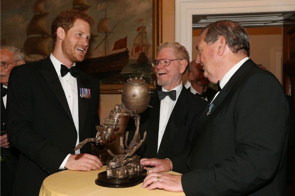Prince Harry, sculptor Les Johnson and Vernon Monument project manager David Sandiford (right)