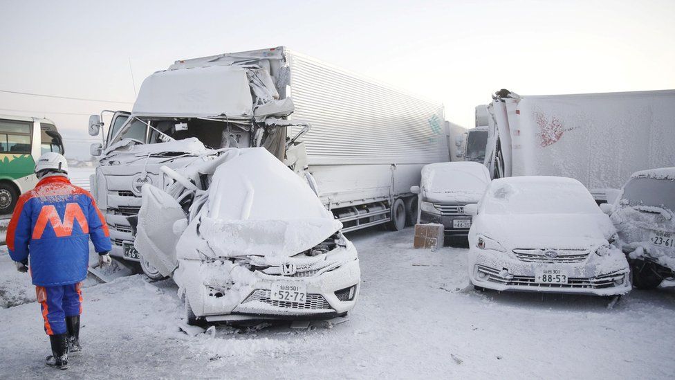 Vehicles are left damaged after the pile-up in Japan