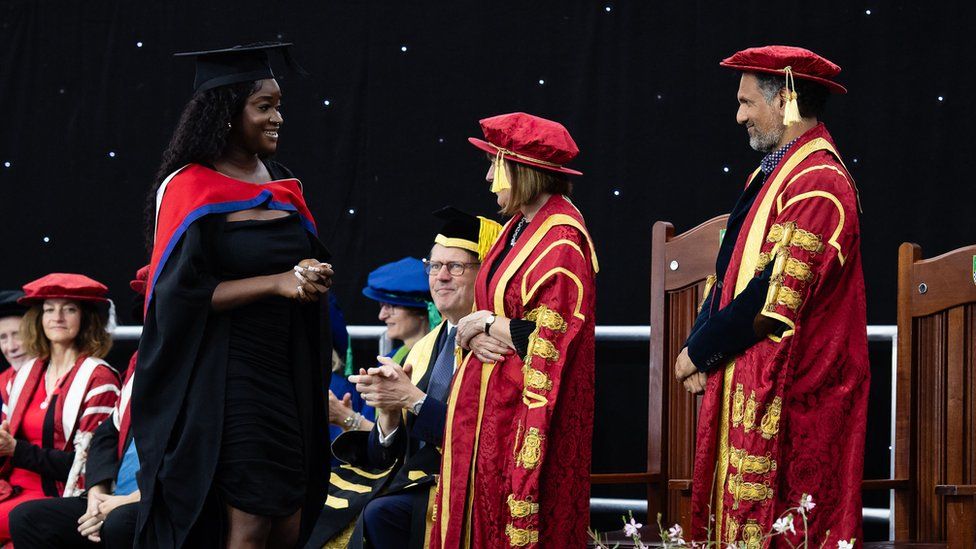 A student at a university graduation ceremony at the University of Bedfordshire, in Luton