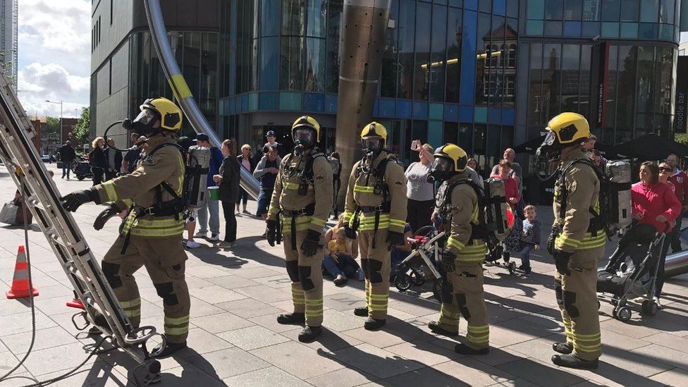 South Wales Fire and Rescue Service firefighters take part in the ladder climb