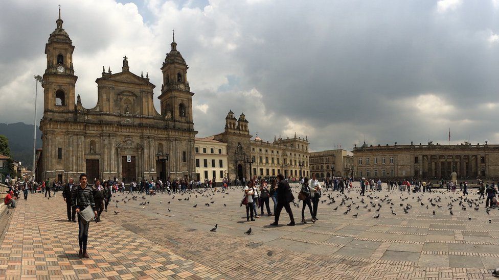 People and birds stroll in Bogota, Colombia