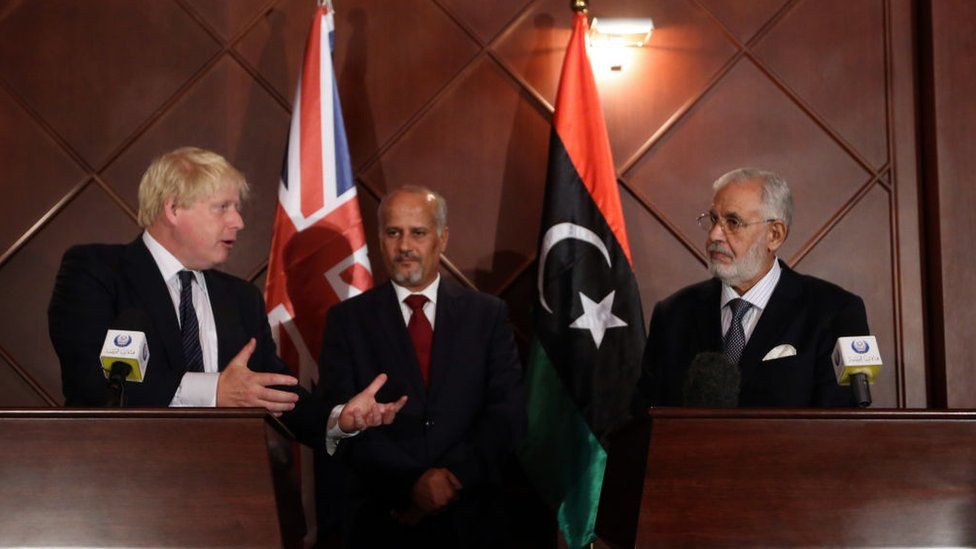 Boris Johnson (L) speaks during a press conference with Mohamed al-Taher Siala (R), Foreign Minister of the UN-backed Libyan Government of National Accord