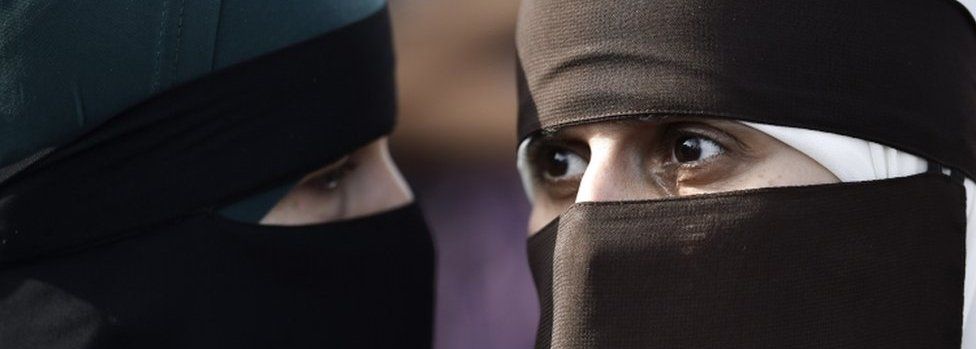 Two women wear niqabs at protest