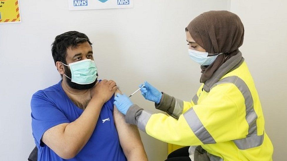 Man being vaccinated in Blackburn