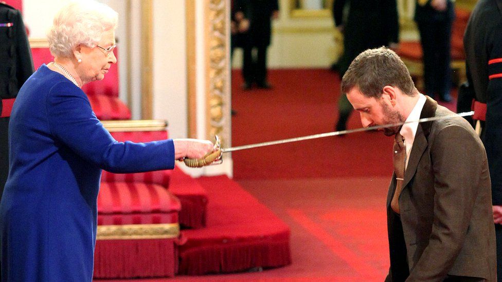Bradley Wiggins is knighted by Britain"s Queen Elizabeth II at Buckingham Palace, central London Tuesday Dec. 10, 2013
