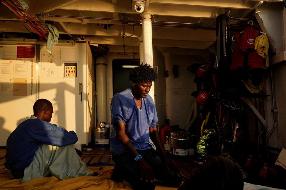 Ahmed, 38, from Sudan, prays on board NGO Proactiva Open Arms rescue boat in central Mediterranean Sea