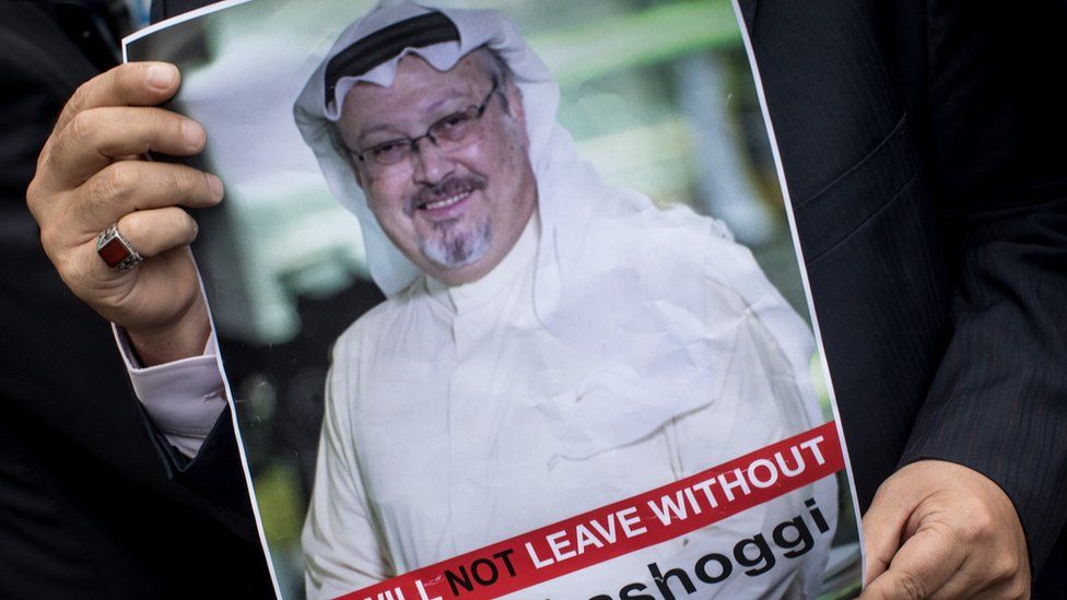 A man holds a poster of Saudi journalist Jamal Khashoggi during a protest outside the Saudi consulate in Istanbul, 8 October 2018