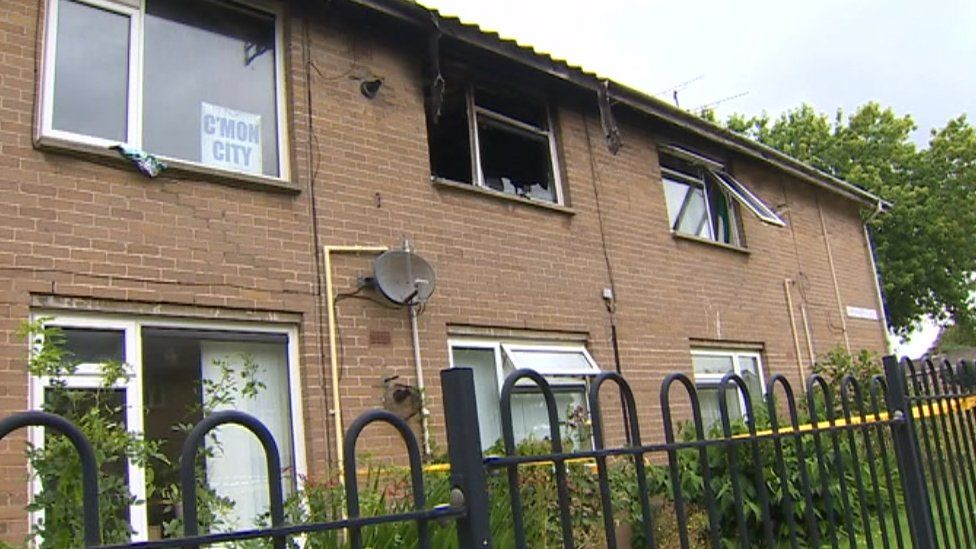 Exterior view of fire-damage first floor flat