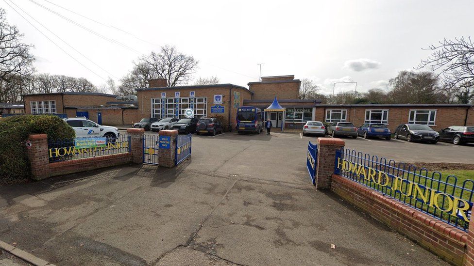 Howard Junior School entrance showing car park and school gates