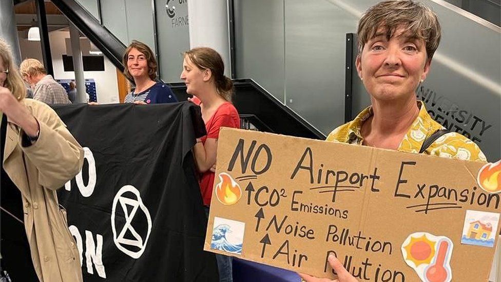 Members of Extinction Rebellion at an airport drop-in event in Farnborough on 20.9.23