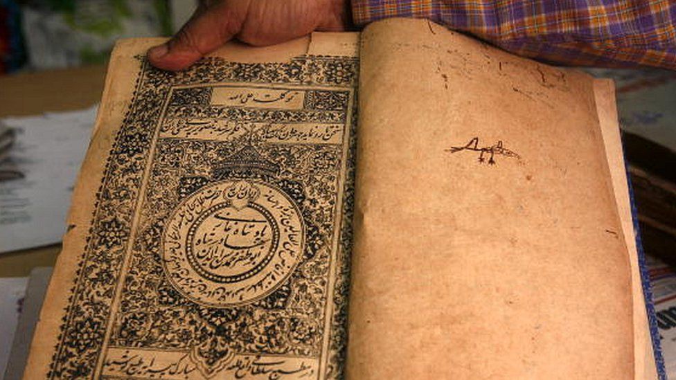A rare urdu book can be seen in a worn out state at the Hazrat Shah Waliullah Public Library in New Delhi on June 28, 2010.
