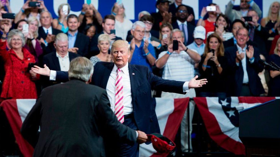 Donald Trump moves to hug Luther Strange in Huntsville