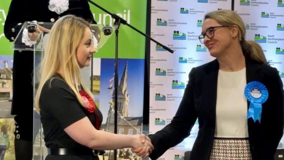 Gen Kitchen shakes hands with Conservative candidate Helen Harrison.