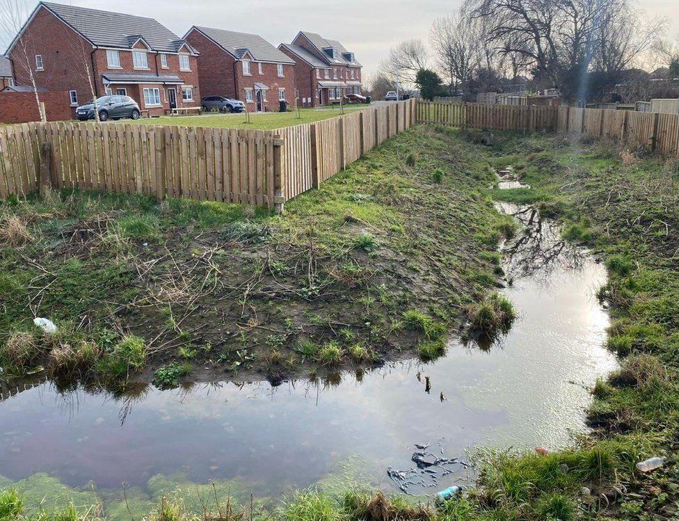 Attenuation pond at a housing estate