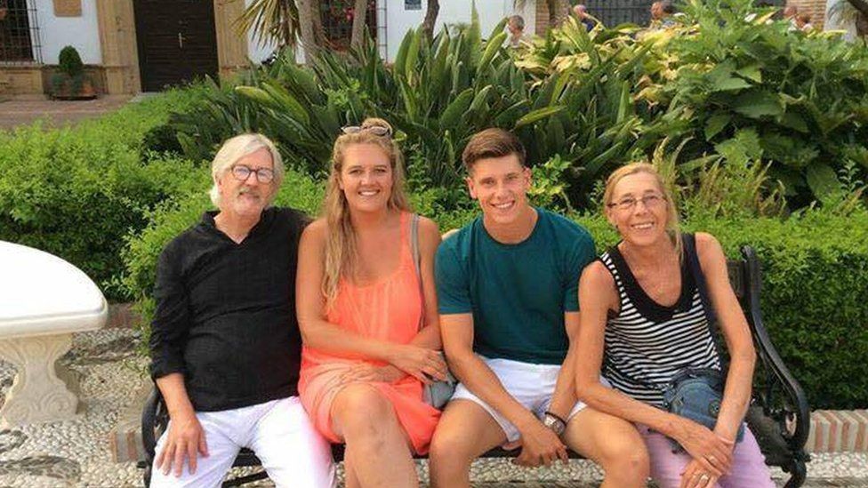 The family on a holiday before Mr Gibson fell ill