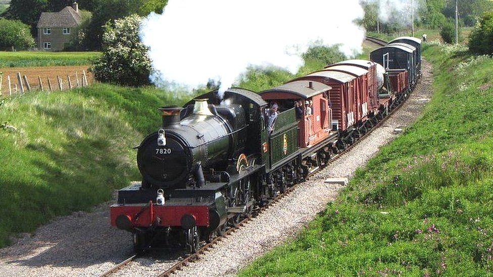 Gloucestershire and Warwickshire Steam Railway train travelling through the Cotswolds