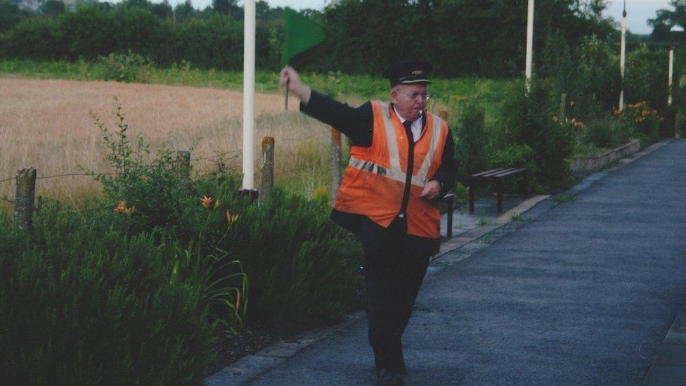 Geoff Clark signalling a train