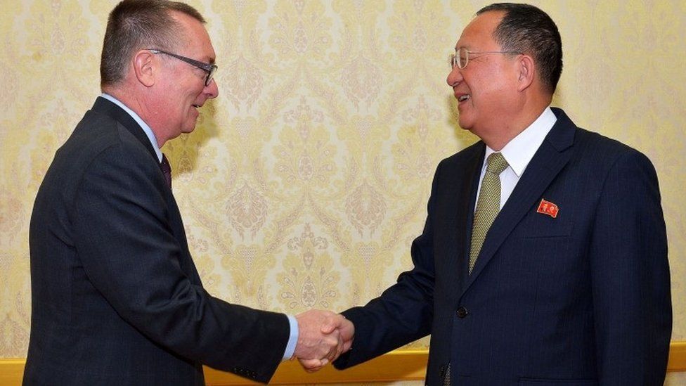 North Korea's Foreign Minister Ri Yong-Ho shakes hands with with Jeffrey Feltman