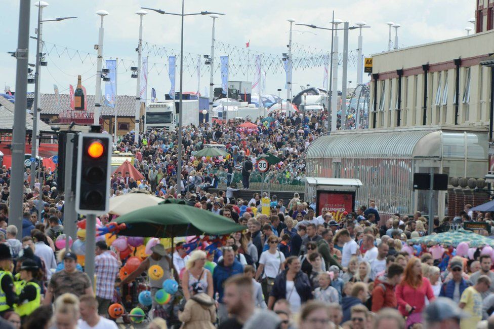 Thousands of people line the streets in Sunderland's Seaburn area