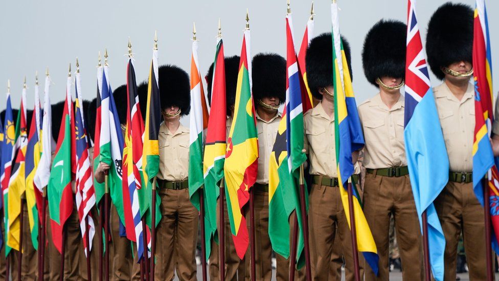 Guards carry flags from Commonwealth countries
