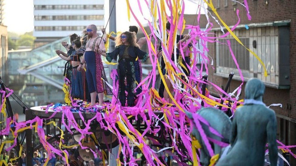 A large amount of confetti is dispersed as performers with the French acrobatics company Gratte Ciel conclude the world premiere of their show 'The Awakening' in Coventry, central England, on May 13, 2022