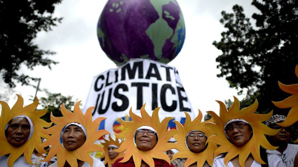 Protesters attend a climate change march in Manila, Philippines on 28 November 2015