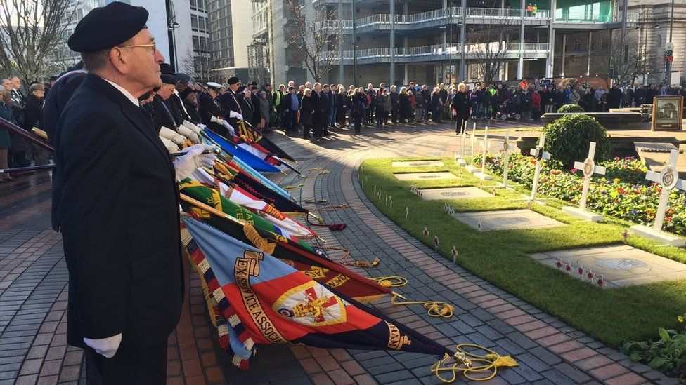 Veterans observe a two minute silence outside Birmingham's Hall of Memory