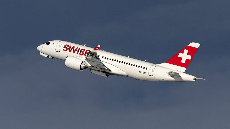 A Swiss Bombardier C-Series CS100 plane takes off from Zurich Airport