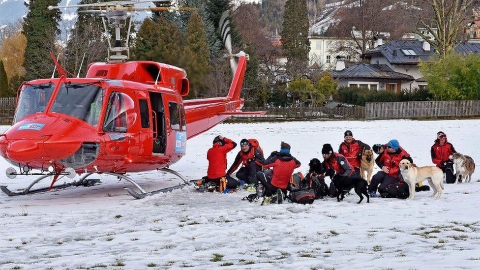 Rescue teams prepare to search for a group of people buried by an avalanche at the Wattener Lizum, Austria, on February 6, 2016