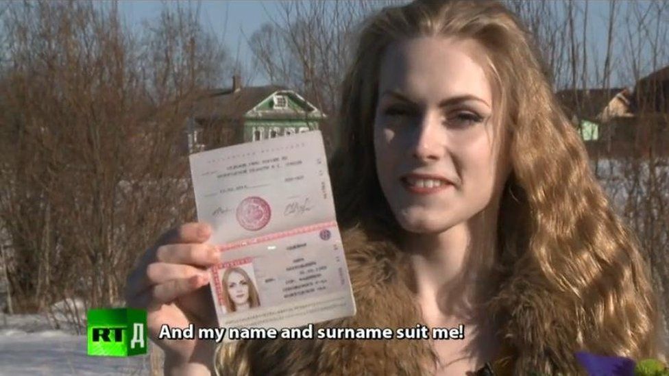 Kira Sadovaya is shown with a new passport, identifying her as female